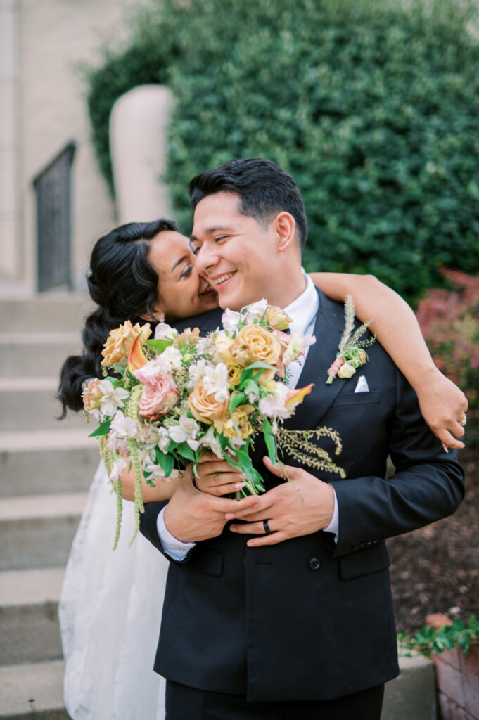 candid moment of the bride and groom laughing and hanging out