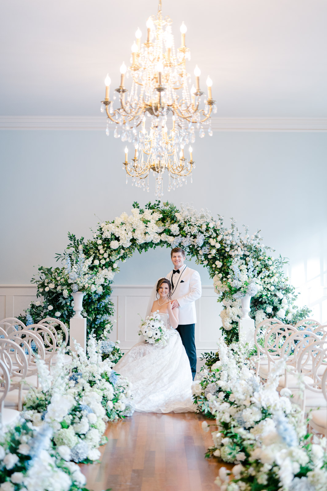 formal wedding portrait at the kansas city club with lush florals